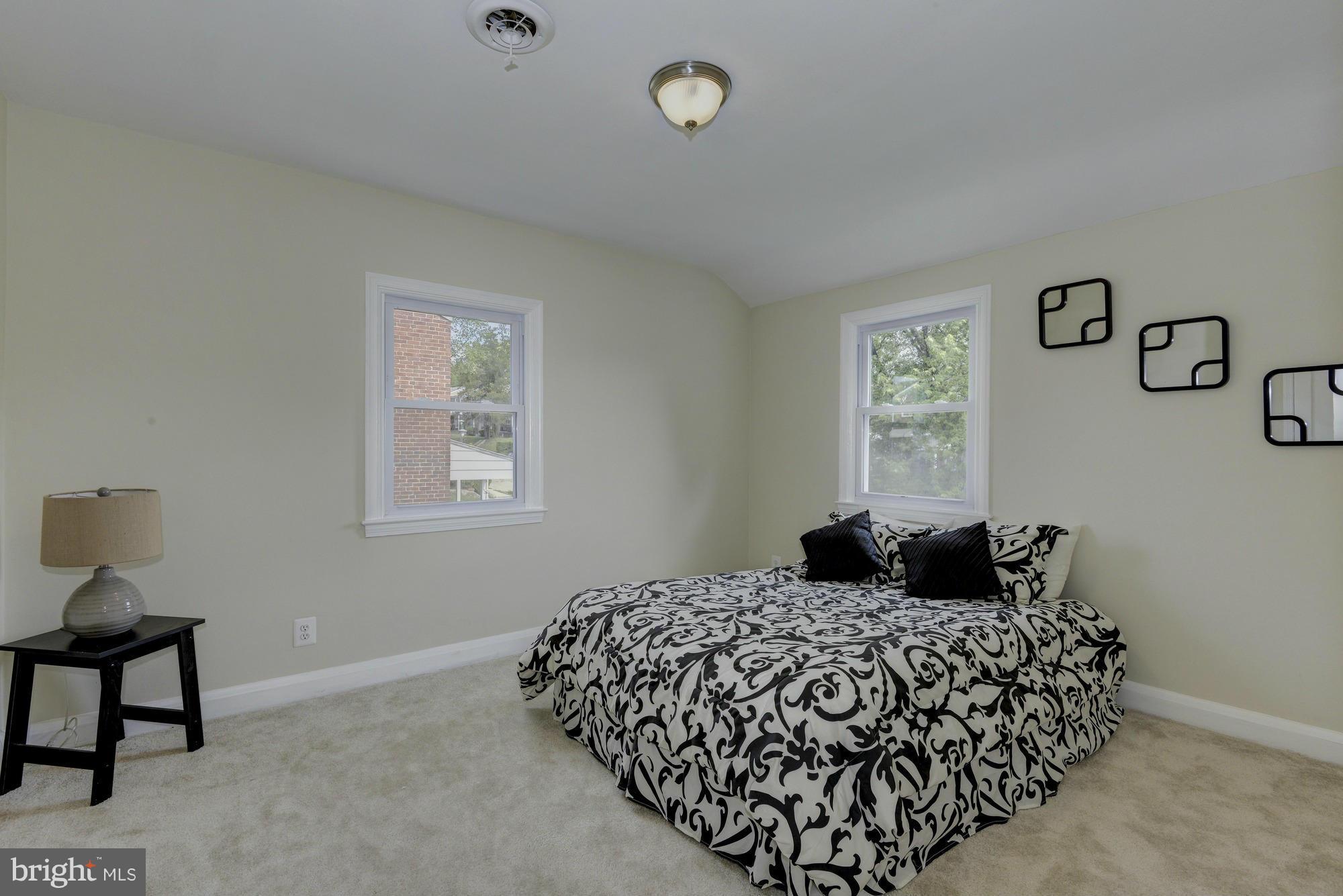 1901 Swansea Road Baltimore, MD 21239 - Photo 17 of 28 a bedroom with a bed and window