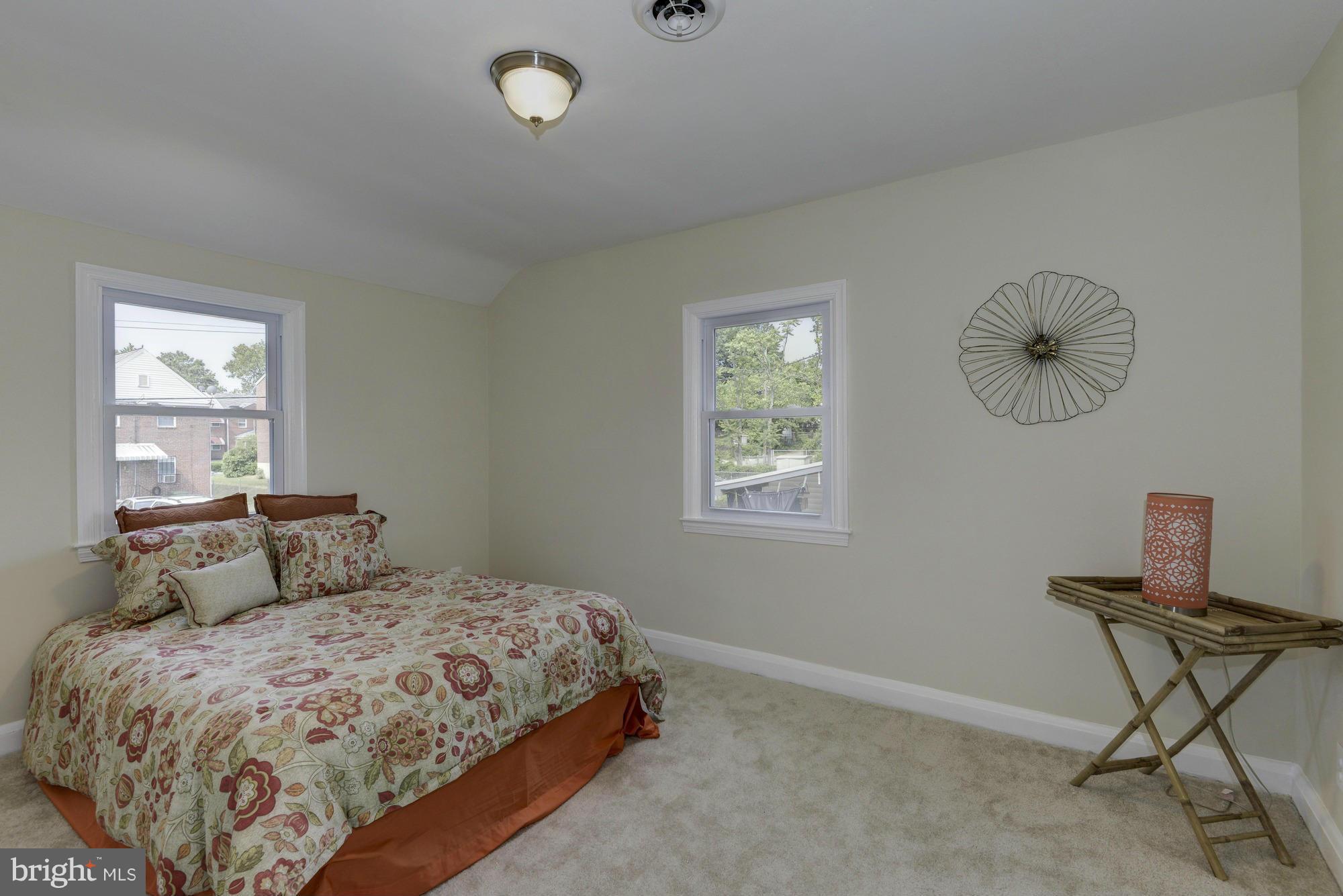 1901 Swansea Road Baltimore, MD 21239 - Photo 19 of 28 a bedroom with a bed window and chair