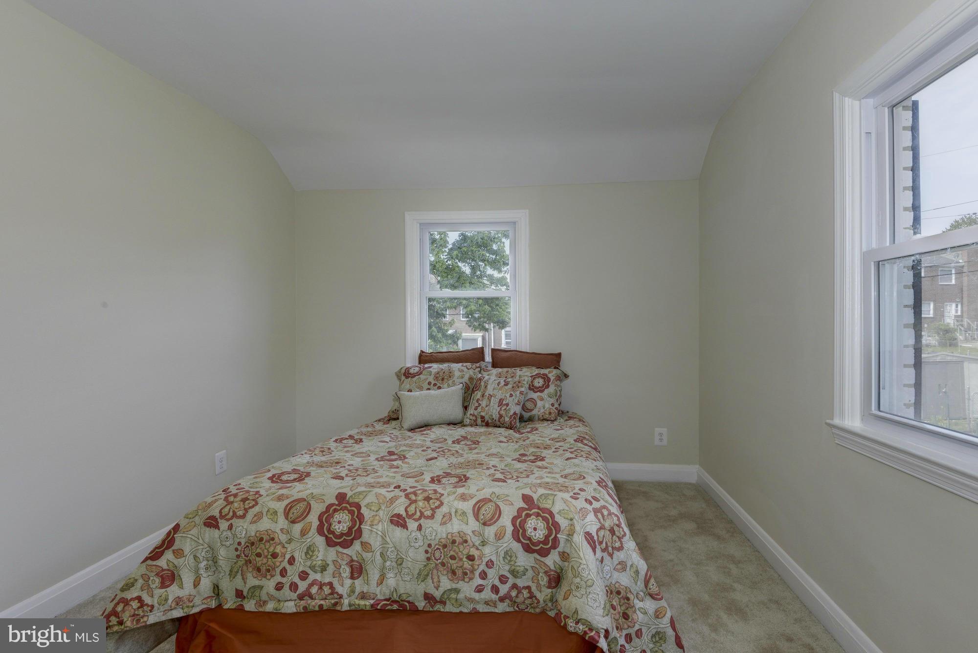 1901 Swansea Road Baltimore, MD 21239 - Photo 20 of 28 a bedroom with a bed and a window