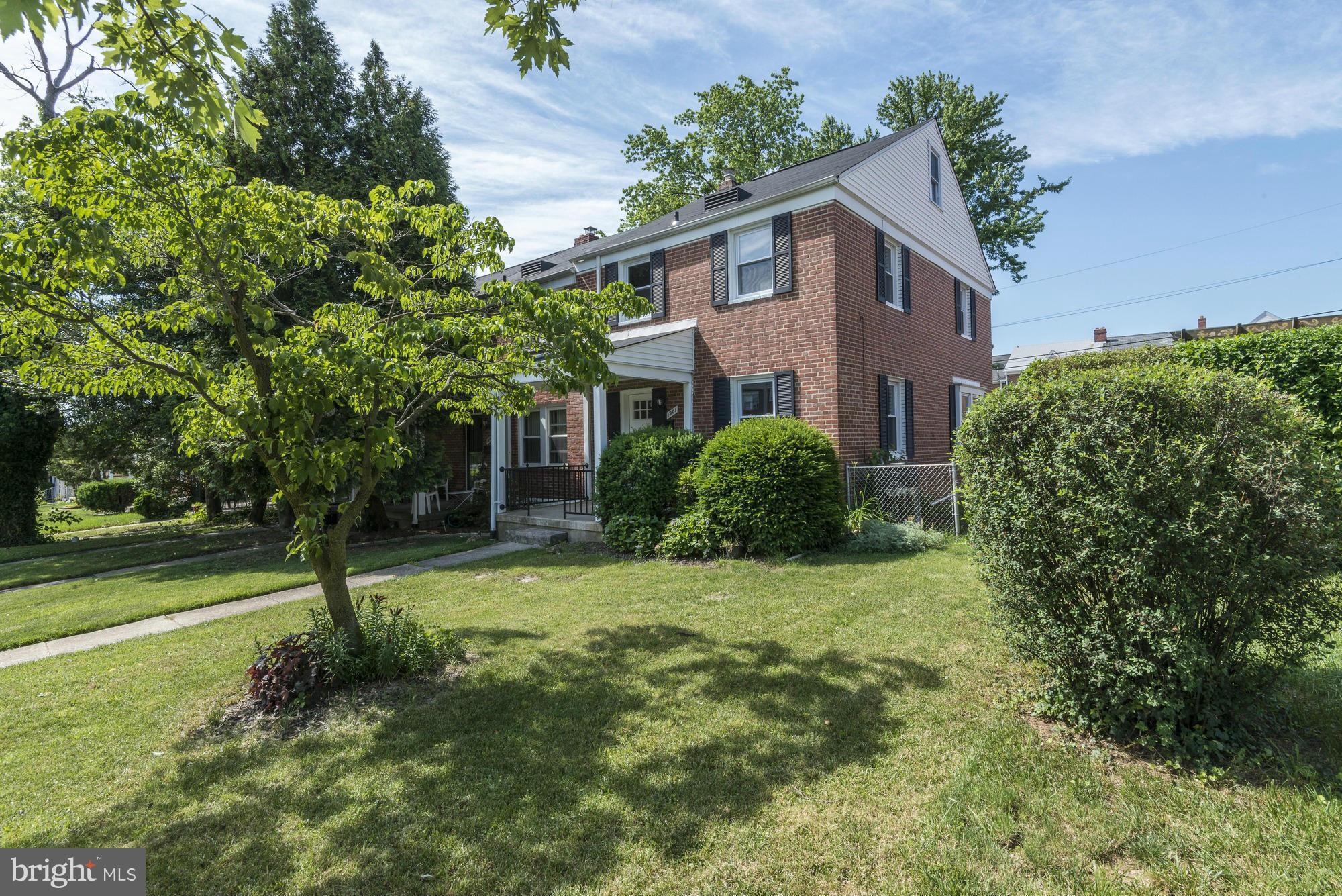 1901 Swansea Road Baltimore, MD 21239 - Photo 2 of 28 a front view of a house with a yard