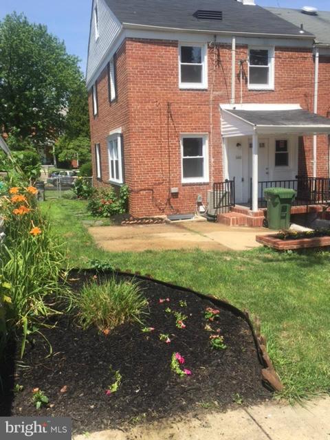 1901 Swansea Road Baltimore, MD 21239 - Photo 27 of 28 a view of a house with backyard sitting area and garden