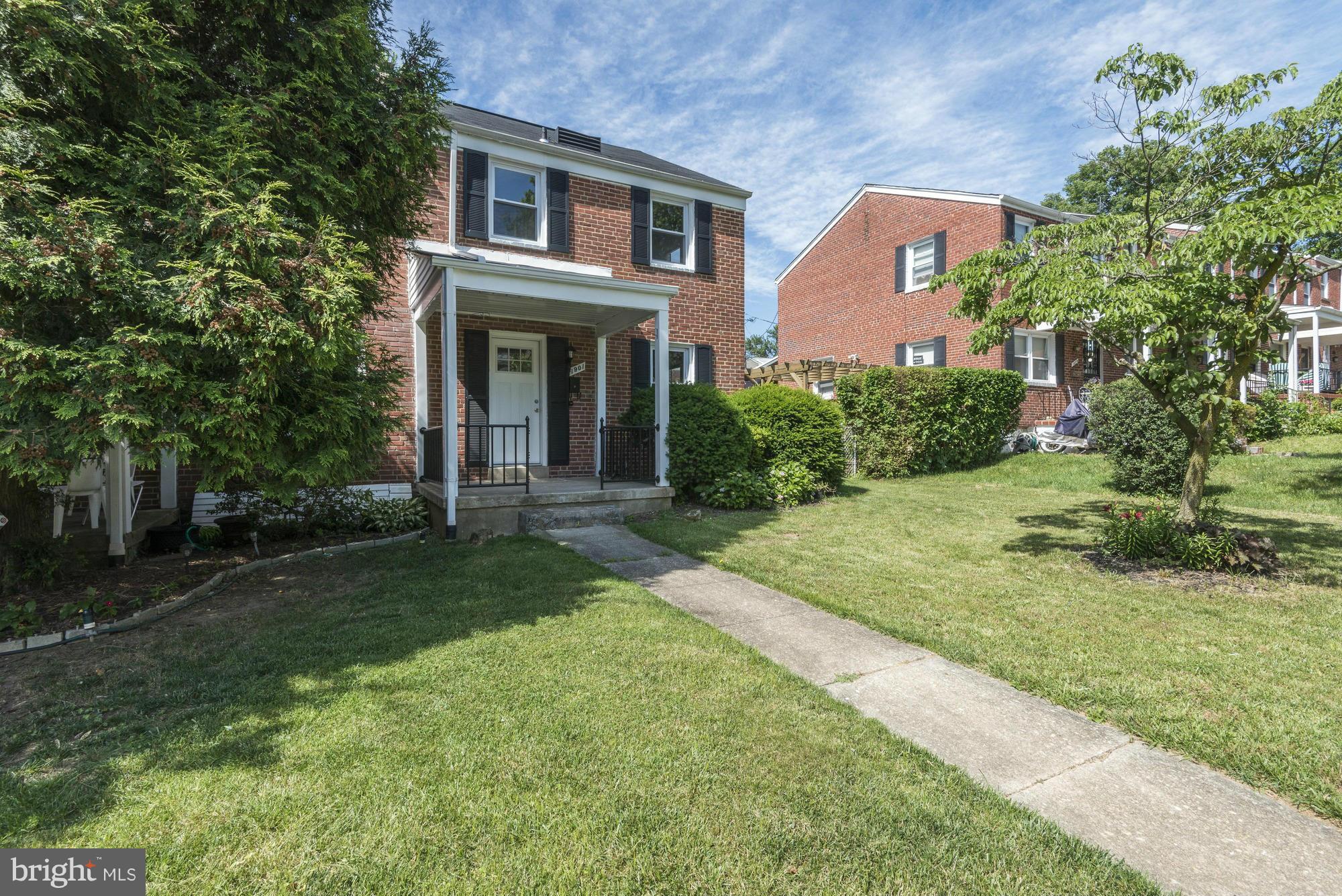 1901 Swansea Road Baltimore, MD 21239 - Photo 3 of 28 a front view of a house with garden