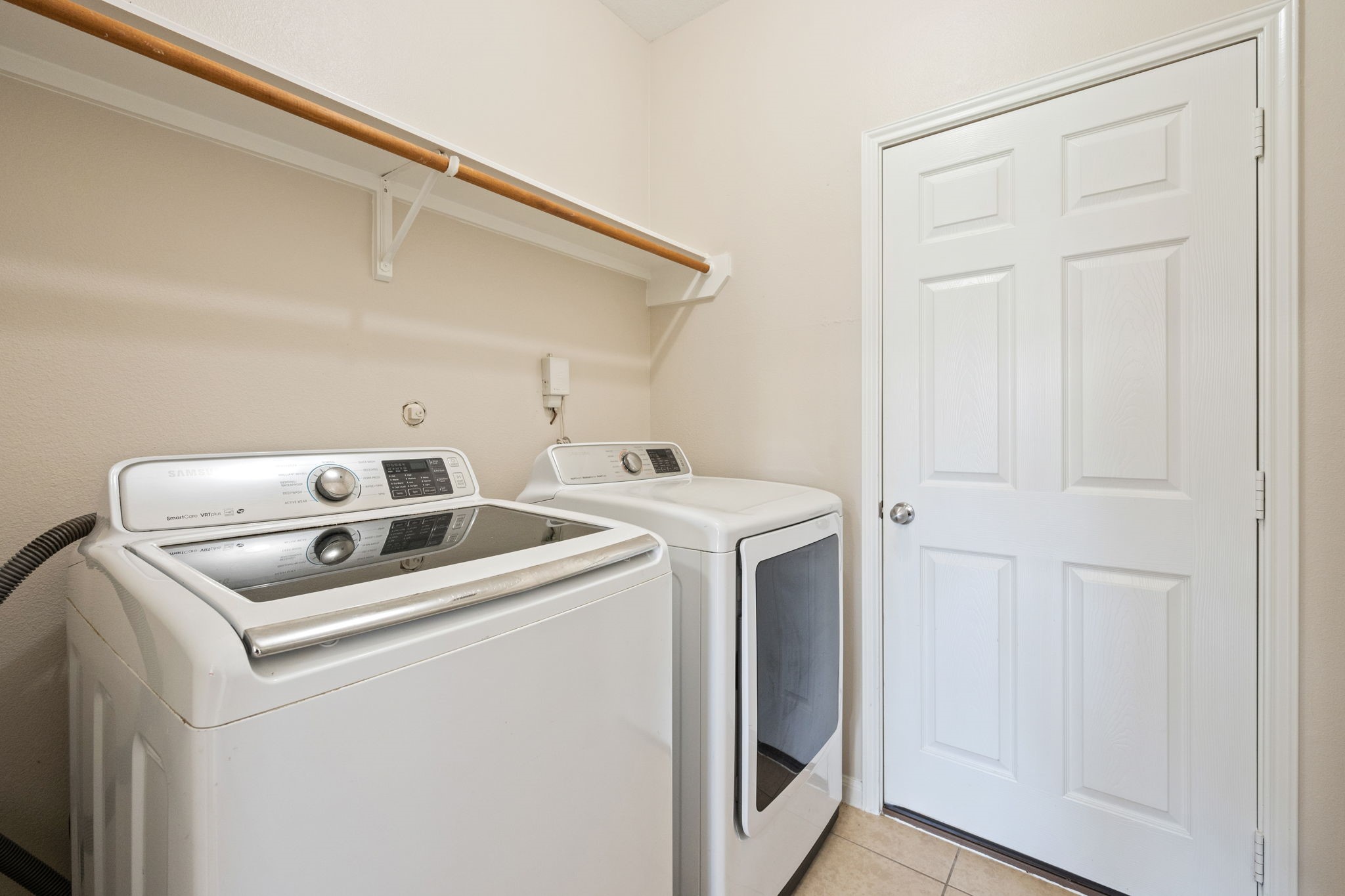 803 Marigold Road Baytown, TX 77521 - Photo 15 of 31 a utility room with dryer and washer