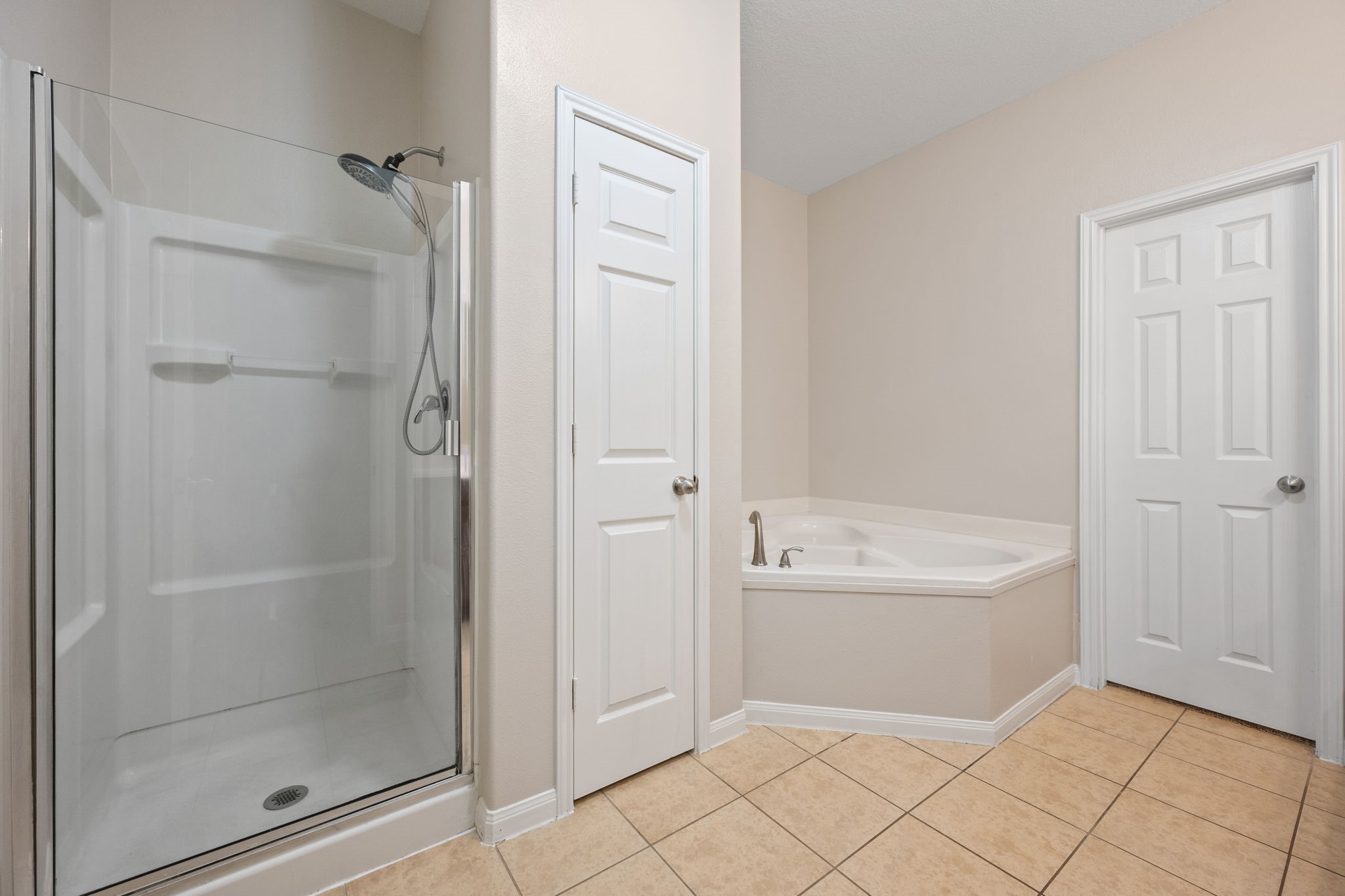 803 Marigold Road Baytown, TX 77521 - Photo 19 of 31 a bathroom with a bathtub a shower and a sink