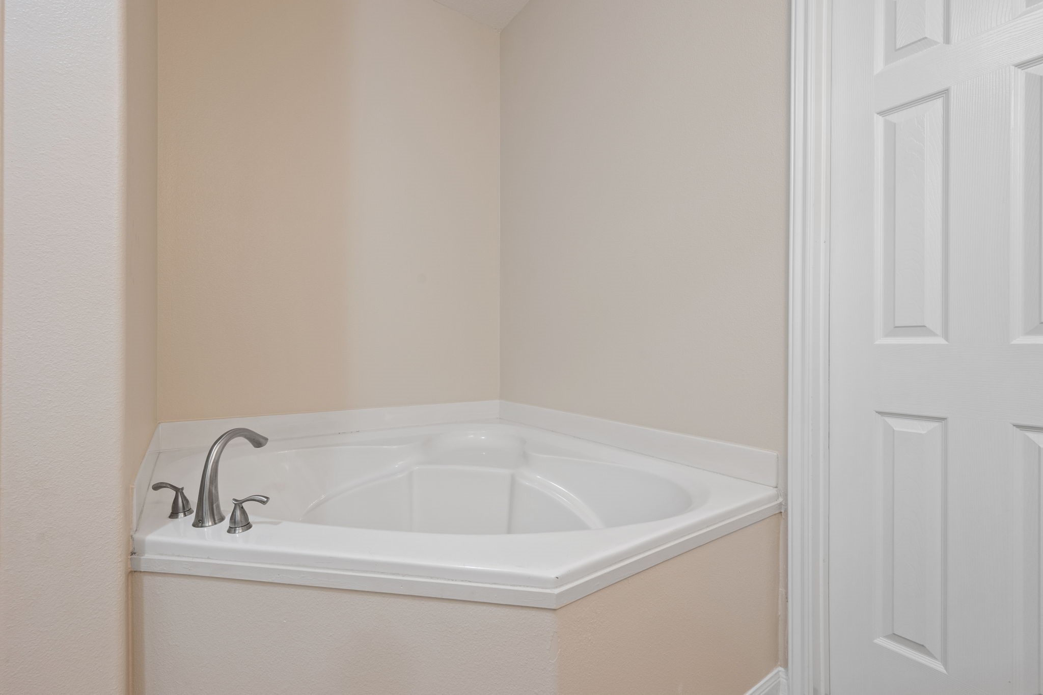 803 Marigold Road Baytown, TX 77521 - Photo 20 of 31 a white bath tub sitting next to a white sink