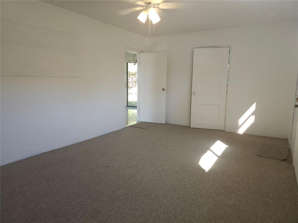 2720 North Avocado Road Avon Park, FL 33825 - Photo 18 of 35 a view of a livingroom with a ceiling fan and window