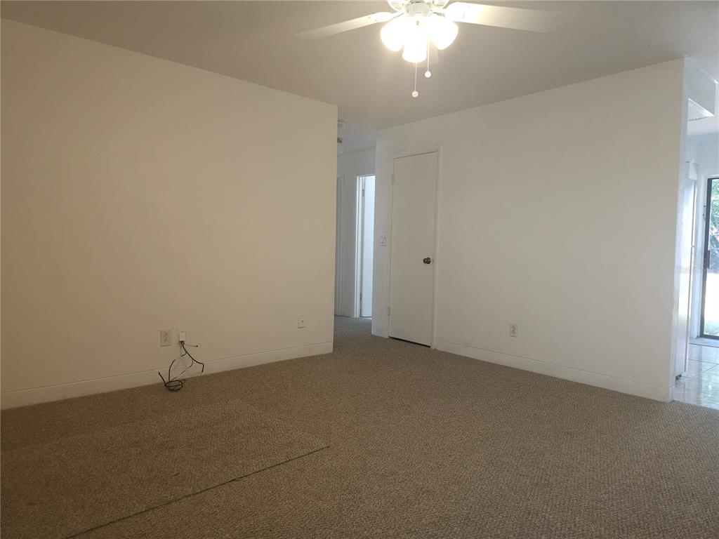 2720 North Avocado Road Avon Park, FL 33825 - Photo 21 of 35 an empty room with a ceiling fan and window