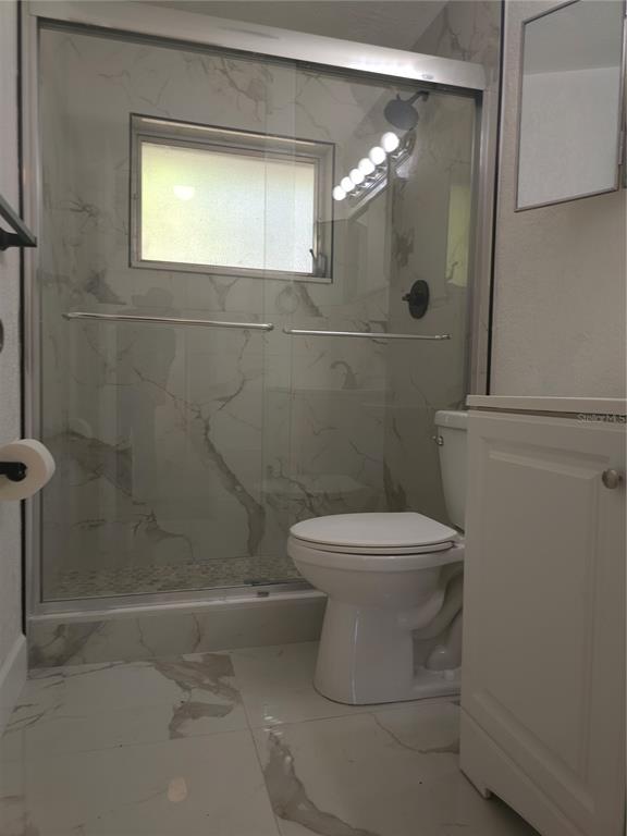 2720 North Avocado Road Avon Park, FL 33825 - Photo 24 of 35 a bathroom with a toilet and a shower
