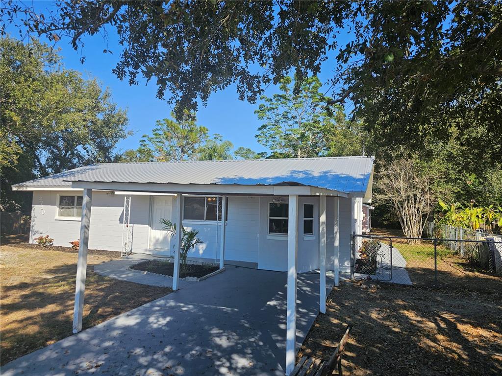 2720 North Avocado Road Avon Park, FL 33825 - Photo 34 of 35 a view of a yard with a tree