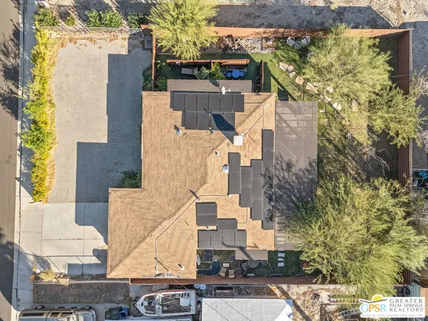 a kitchen with stainless steel appliances granite countertop a stove a sink and a refrigerator with wooden floor