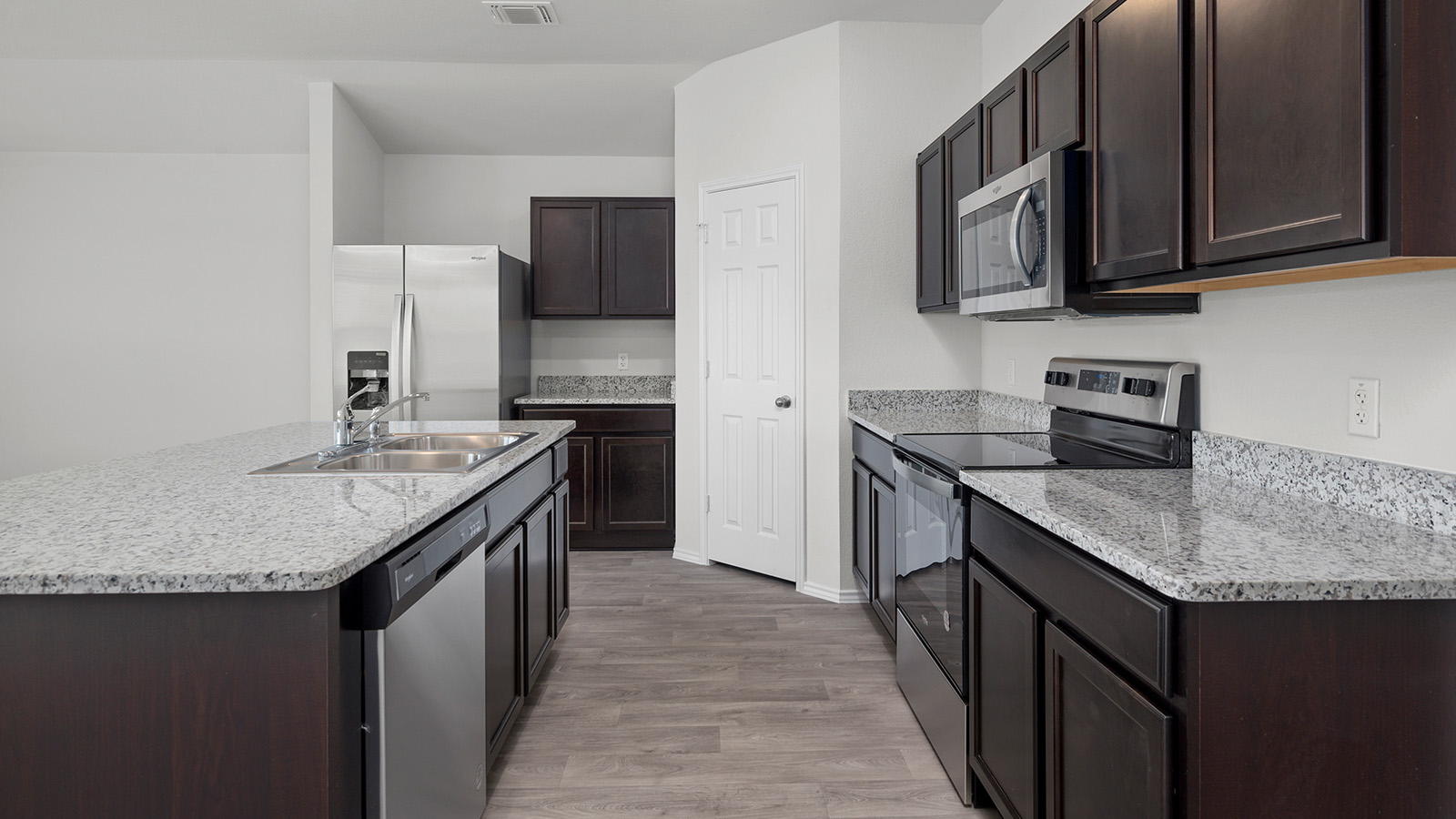 1407 Victory Rnch Trail Killeen, TX 76549 - Photo 4 of 24 A well-appointed kitchen showcasing durable wood-look flooring and ample counter space.