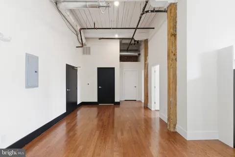 a view of hallway with wooden floor