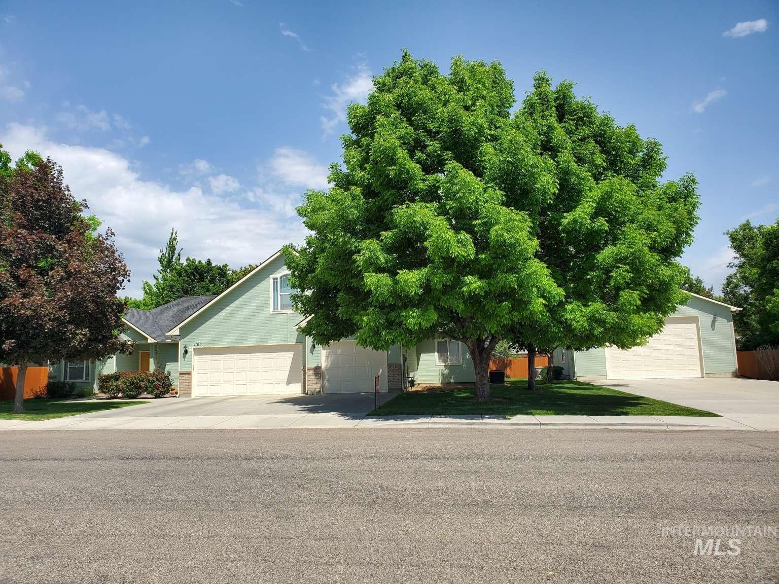 1100 East Wright Street Boise, ID 83706 - Photo 1 of 25 Light green siding exterior with a dark roof