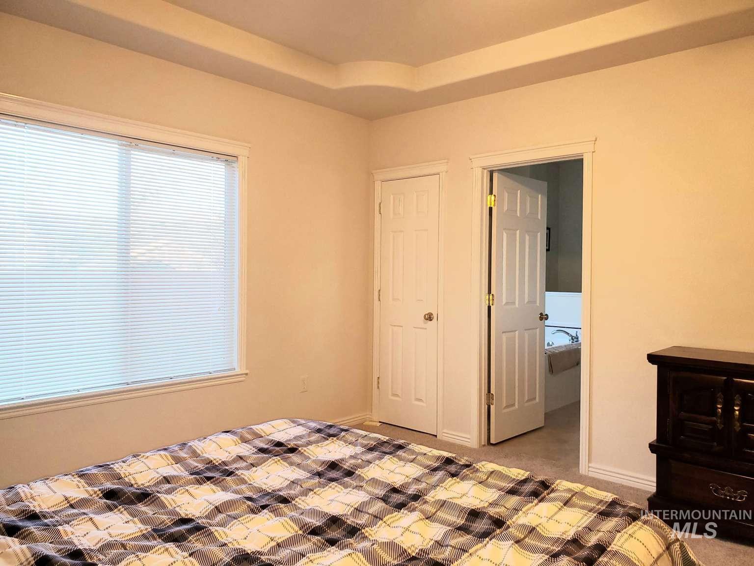 1100 East Wright Street Boise, ID 83706 - Photo 15 of 25 Unfurnished bedroom with carpet flooring and baseboards