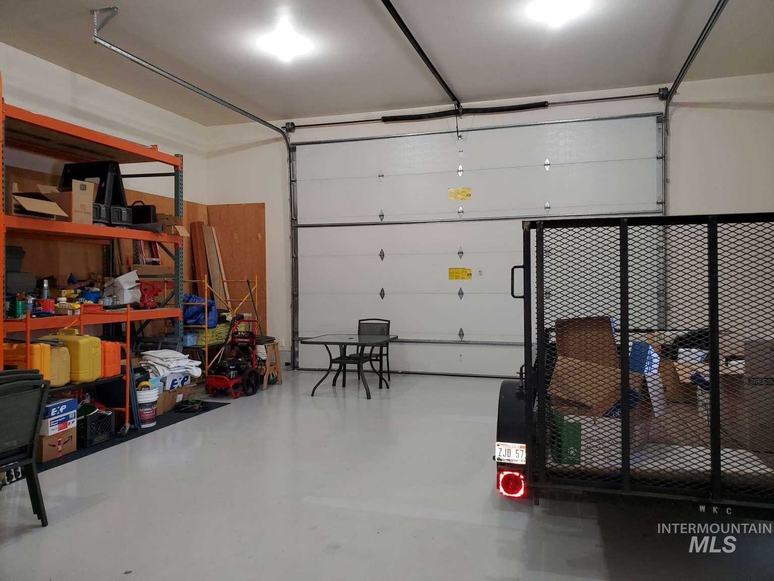 1100 East Wright Street Boise, ID 83706 - Photo 23 of 25 Spacious garage with light-toned flooring and overhead lighting