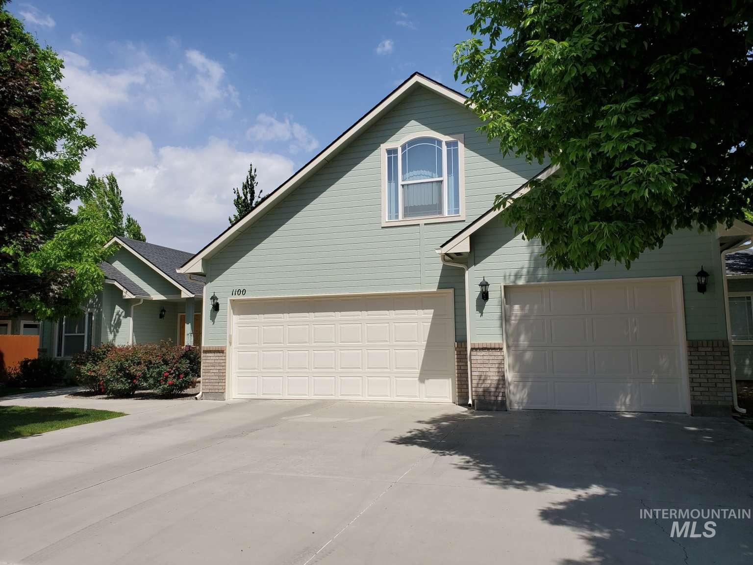 1100 East Wright Street Boise, ID 83706 - Photo 3 of 25 Contemporary home exterior featuring light green siding and brick accents