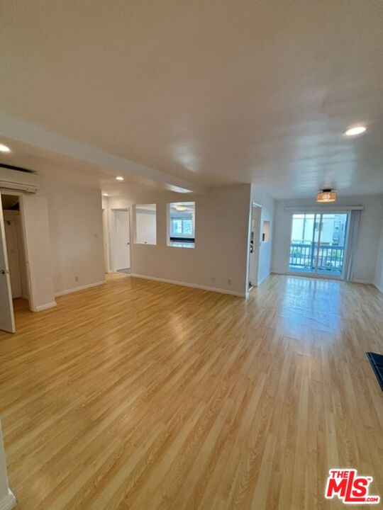 24 Lighthouse Street, Unit A Marina del Rey, CA 90292 - Photo 12 of 39 a view of an empty room and wooden floor