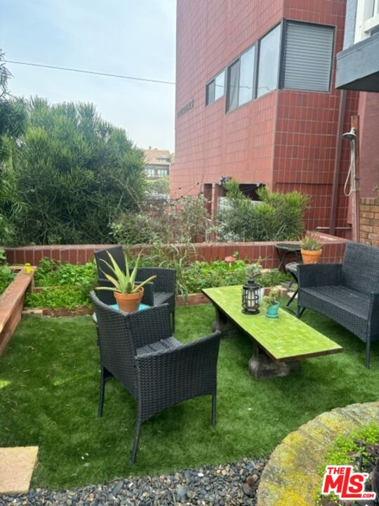 24 Lighthouse Street, Unit A Marina del Rey, CA 90292 - Photo 9 of 39 a view of a house with pool and a yard