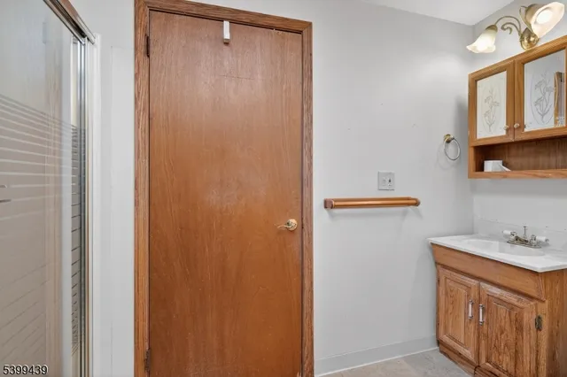 a view of a backyard with wooden fence