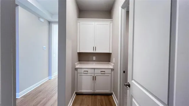 a kitchen with a sink and a stove top oven