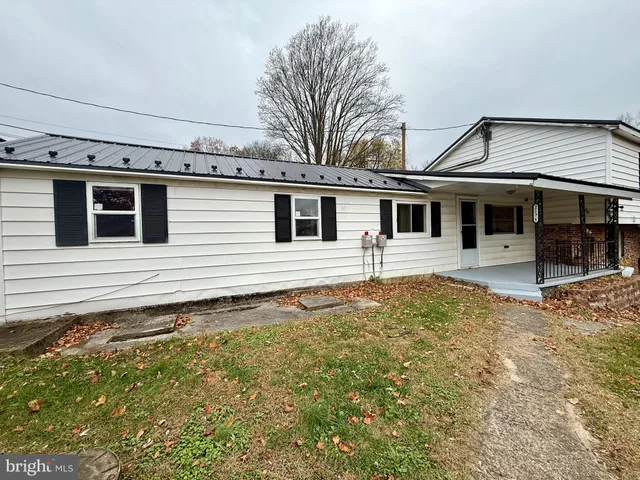 a house with trees in the background