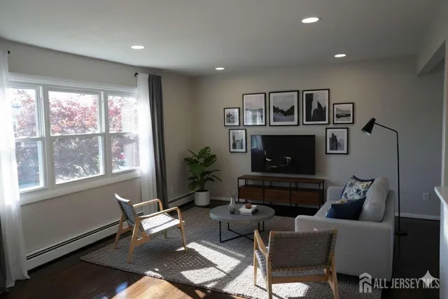 a living room with furniture fireplace and flat screen tv