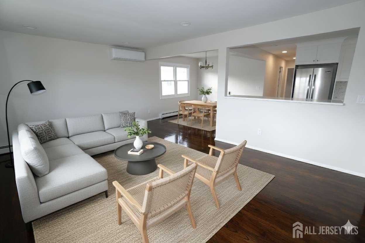 679 Rensselaer Avenue Staten Island, NY 10312 - Photo 4 of 6 a living room with furniture and wooden floor