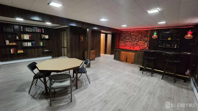 a room with furniture and a flat screen tv