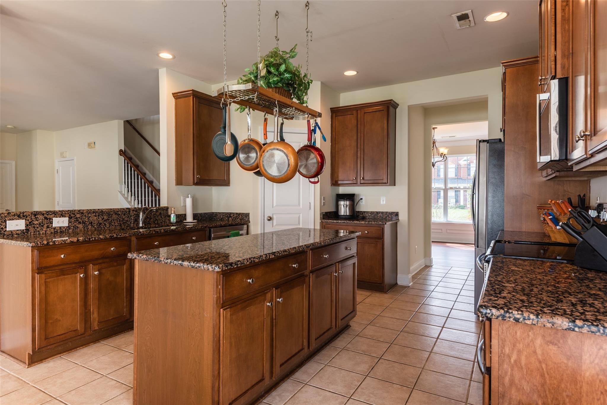 2012 Apogee Drive Indian Trail, NC 28079 - Photo 13 of 28 a kitchen with stainless steel appliances granite countertop a stove and a sink