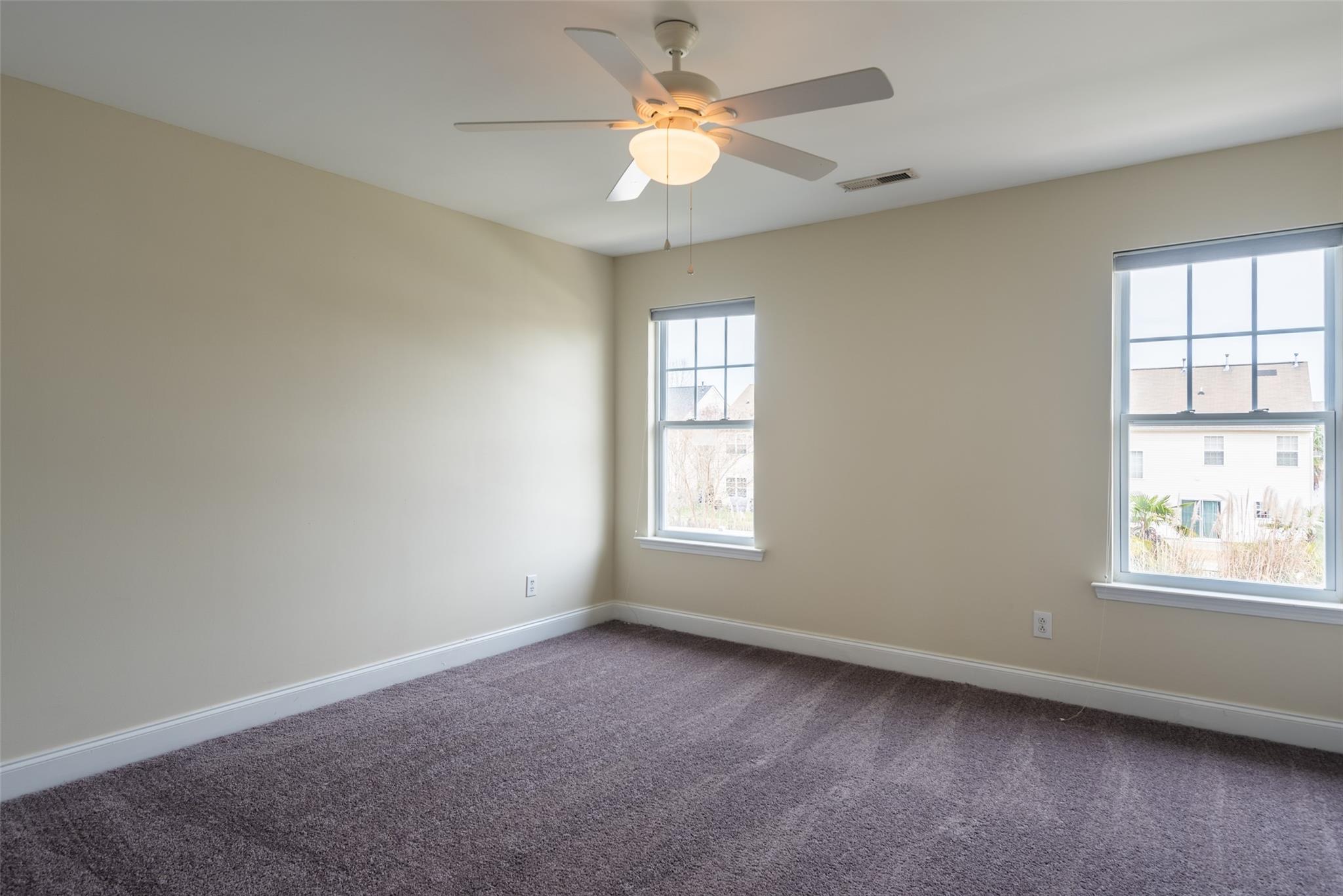 2012 Apogee Drive Indian Trail, NC 28079 - Photo 20 of 28 an empty room with a window and a fan