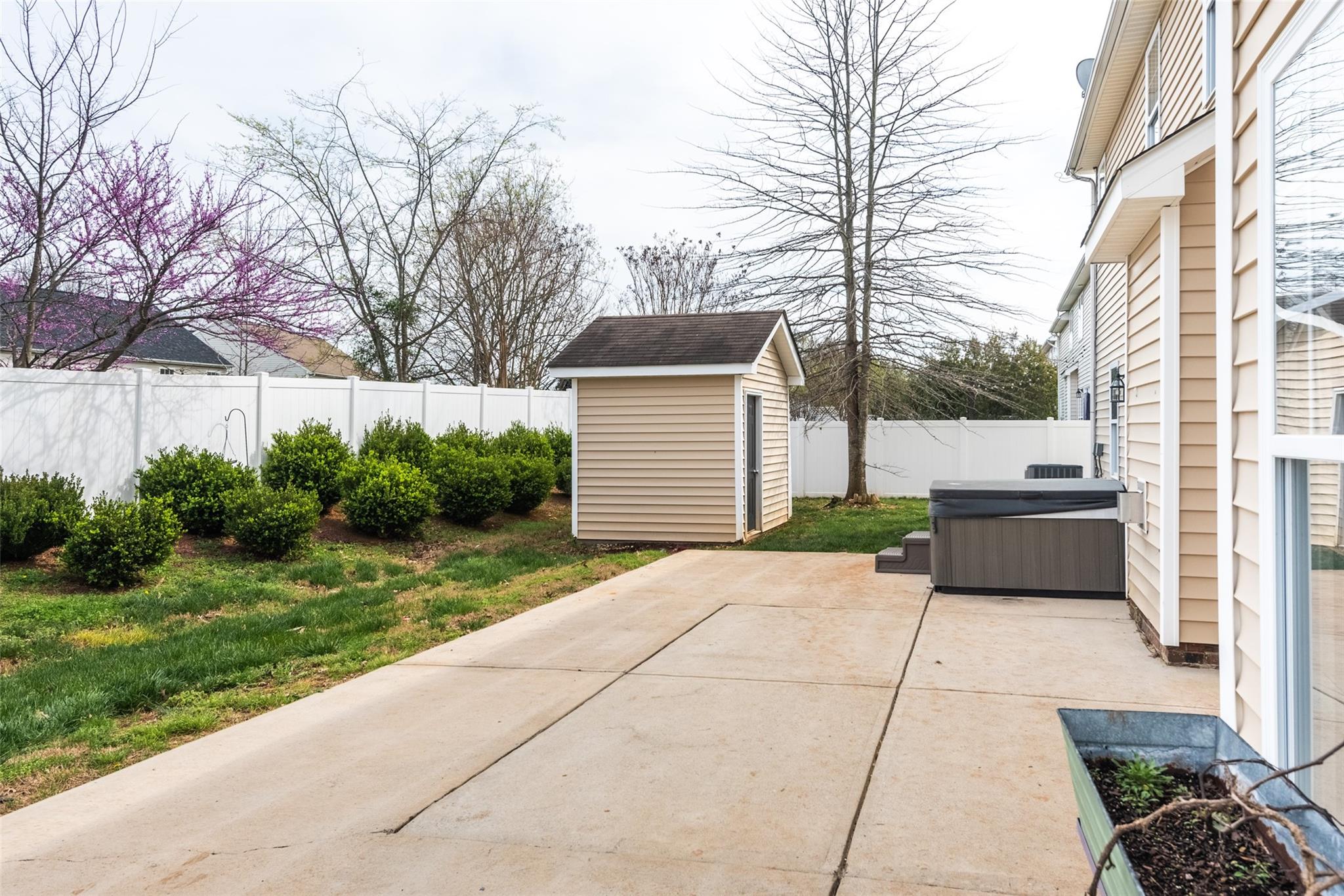 2012 Apogee Drive Indian Trail, NC 28079 - Photo 28 of 28 a front view of a house with a garden and trees