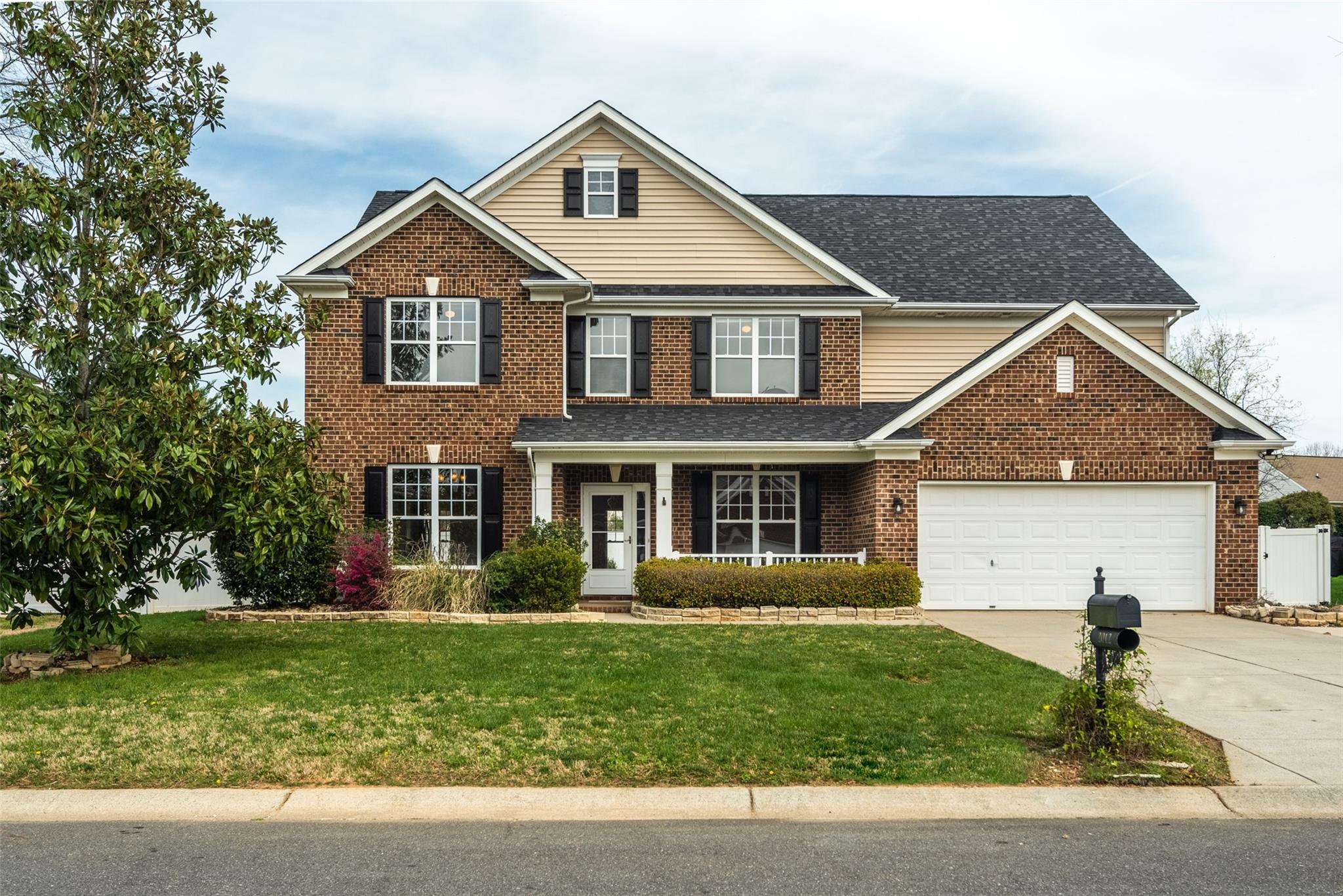 2012 Apogee Drive Indian Trail, NC 28079 - Photo 3 of 28 a front view of a house with a yard