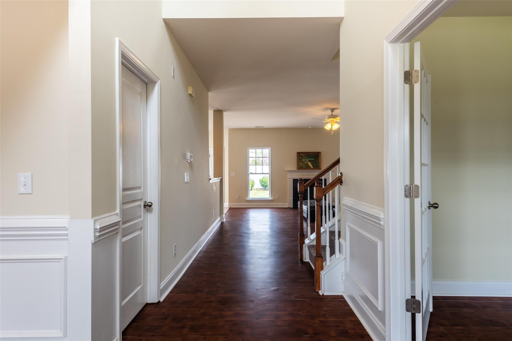 2012 Apogee Drive Indian Trail, NC 28079 - Photo 8 of 28 a hallway and a livingroom with furniture stairs