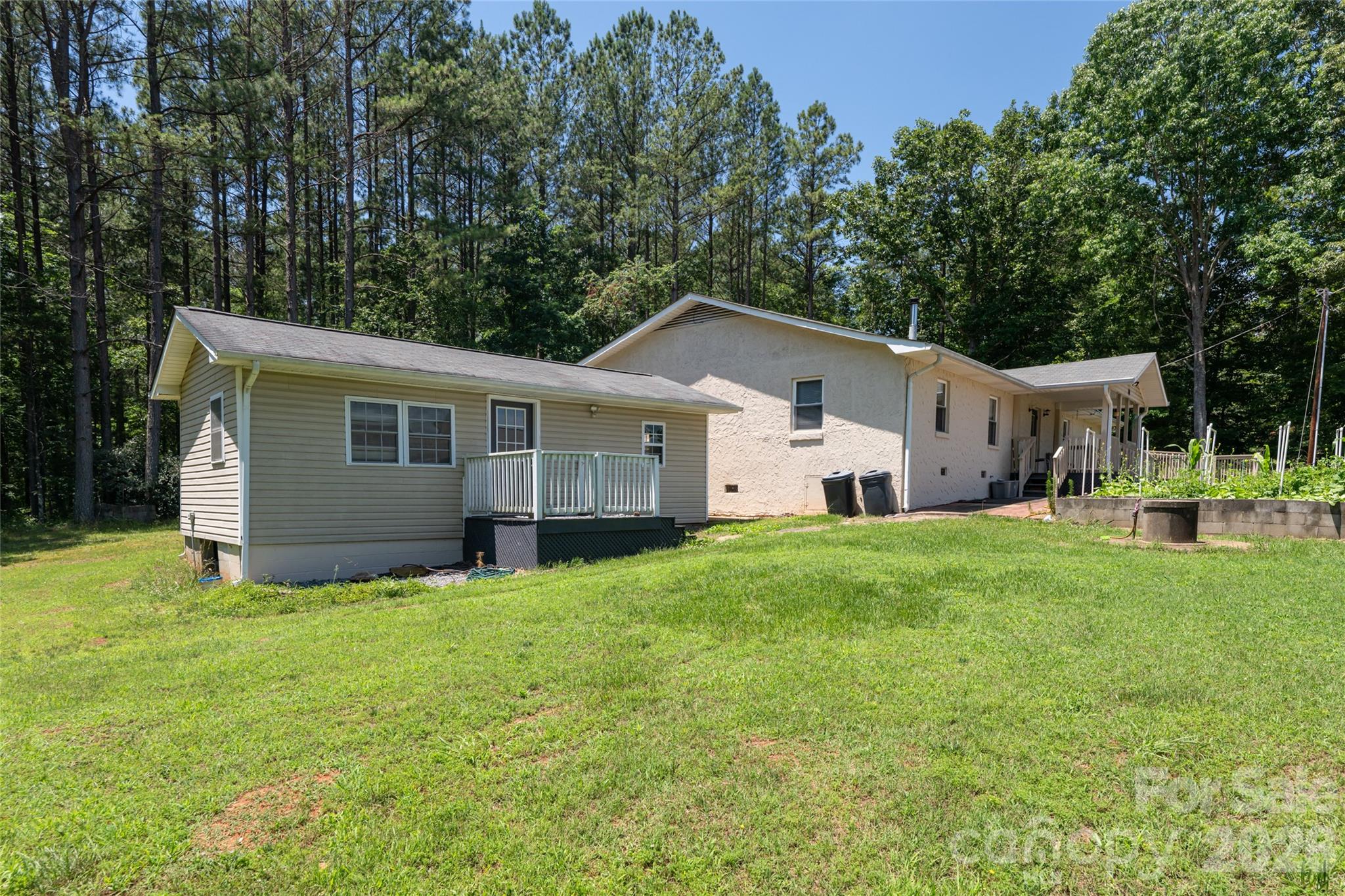 2800 Coxe Road Tryon, NC 28782 - Photo 23 of 40 a view of a house with backyard and garden