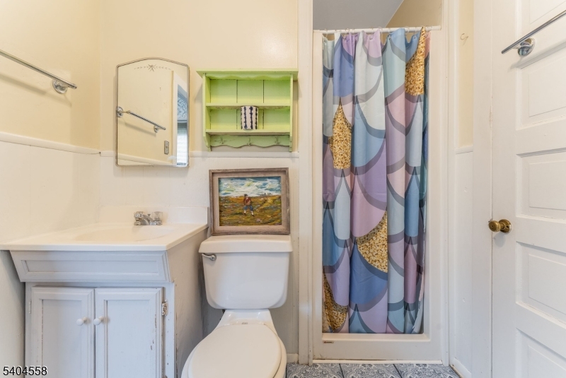 400 Church Street, Unit A Hackettstown, NJ 07840 - Photo 13 of 19 a bathroom with a toilet and a shower curtain