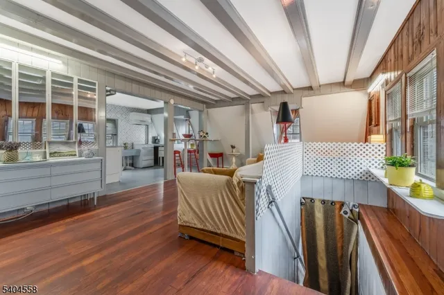 a kitchen with stainless steel appliances kitchen island granite countertop a refrigerator and a stove top oven