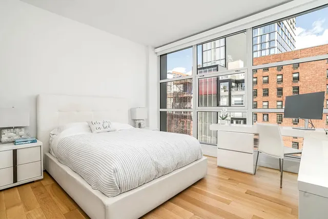 a living room with furniture and next to a window