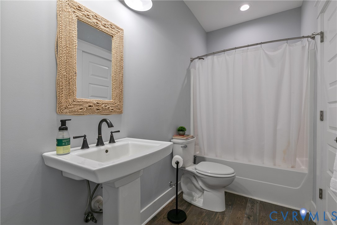 9749 Hoke Brady Road Henrico, VA 23231 - Photo 23 of 53 a bathroom with a sink a toilet and shower
