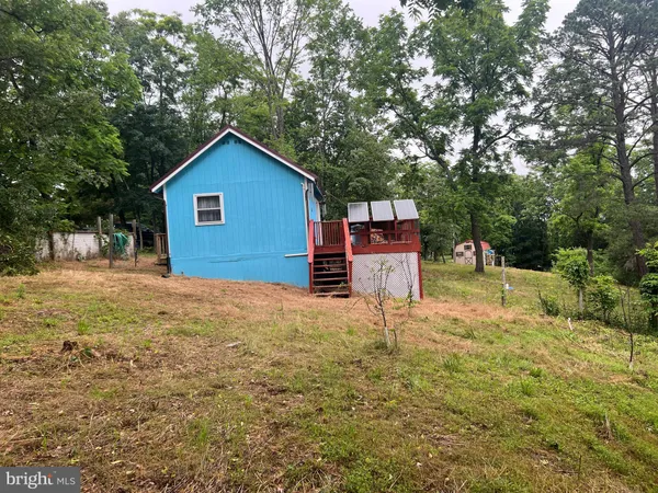 a house view with a backyard space