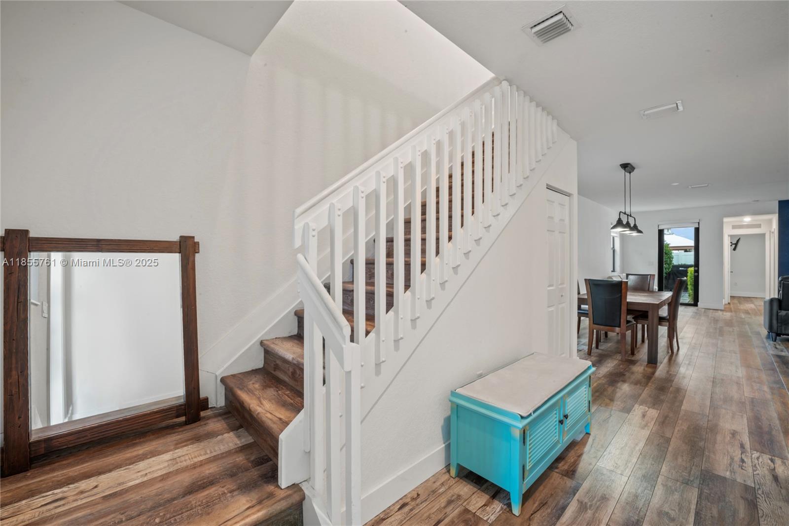 3471 West 110th Street Hialeah, FL 33018 - Photo 12 of 38 a view of entryway and hall with wooden floor