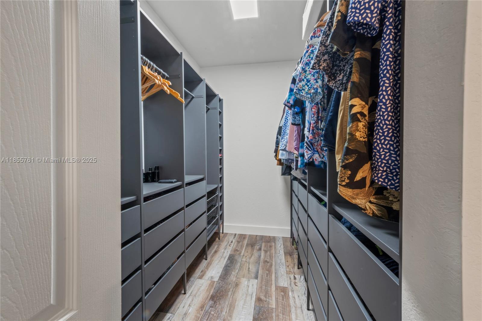 3471 West 110th Street Hialeah, FL 33018 - Photo 20 of 38 a view of walk in closet with clothes
