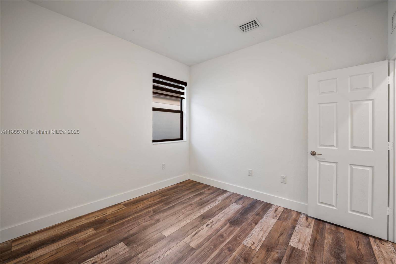 3471 West 110th Street Hialeah, FL 33018 - Photo 25 of 38 a view of empty room with wooden floor and fan