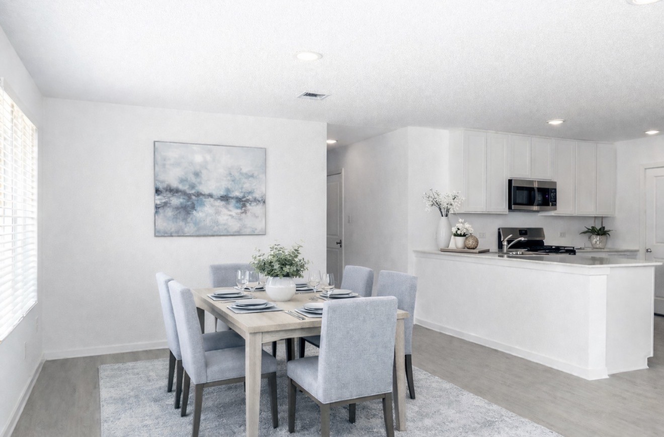 3013 Colusa Rdg Drive Katy, TX 77493 - Photo 4 of 15 a kitchen with stainless steel appliances kitchen island granite countertop a dining table and chairs
