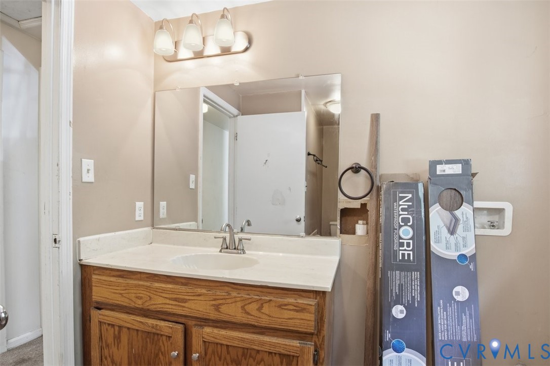 14527 Arwood Road Disputanta, VA 23842 - Photo 14 of 20 a bathroom with a sink and a mirror