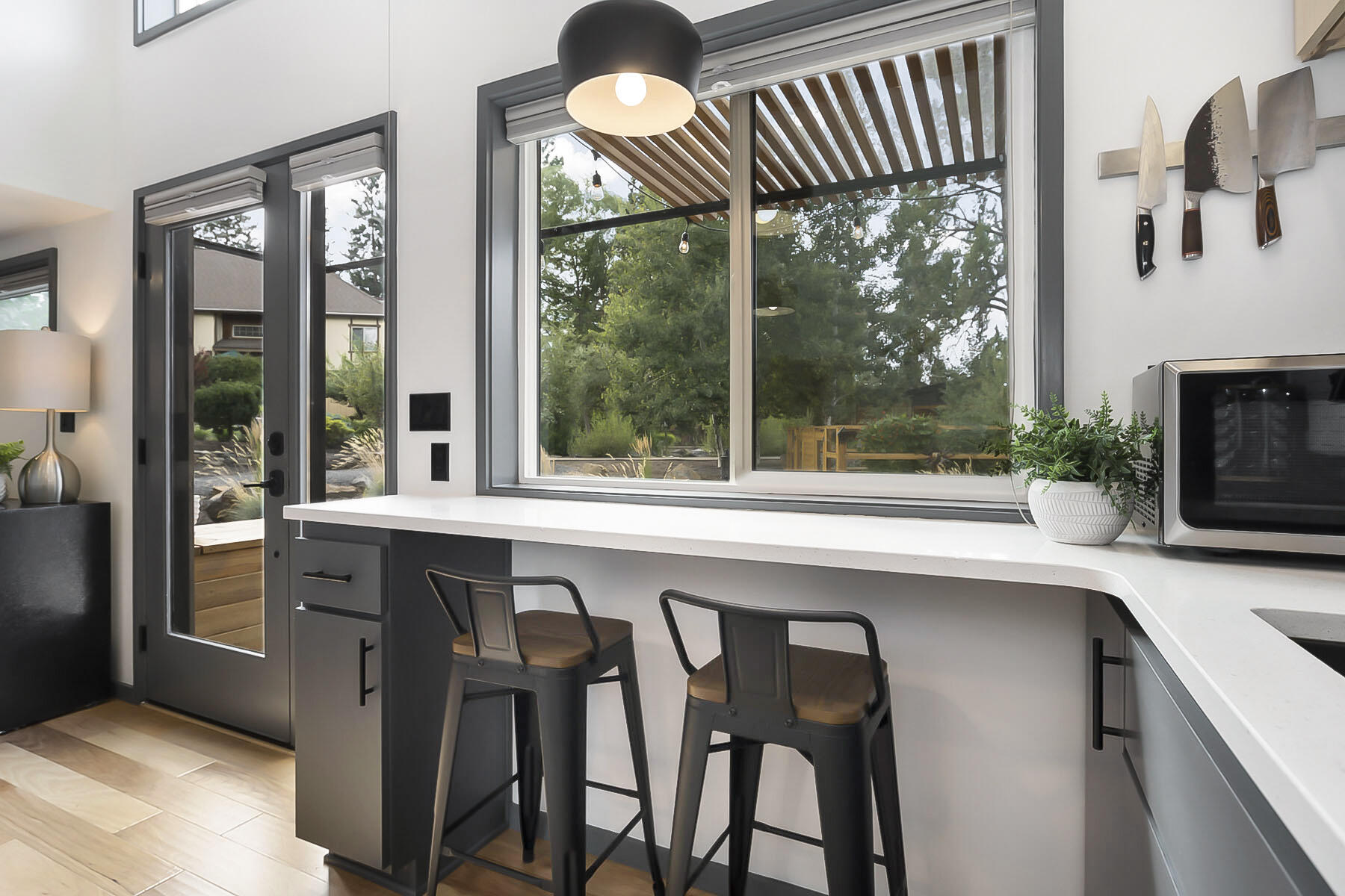 61301 Benham Road, Unit LOT 1 Bend, OR 97702 - Photo 6 of 35 Bar area overlooking the deck and gardens is ideal for additional workspace or enjoying your morning coffee!