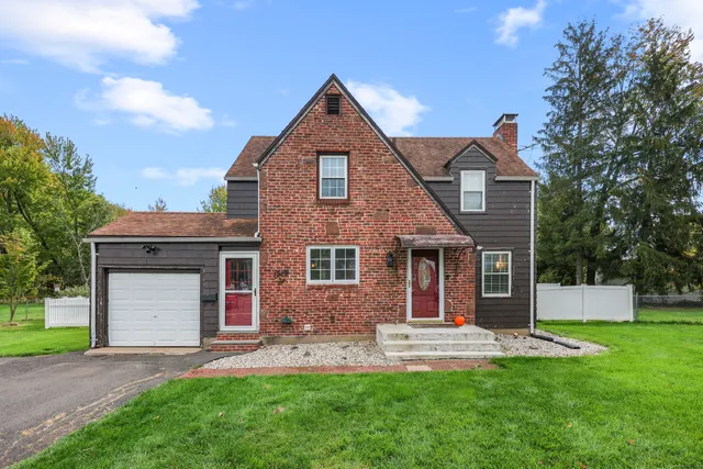 front view of a house with a yard