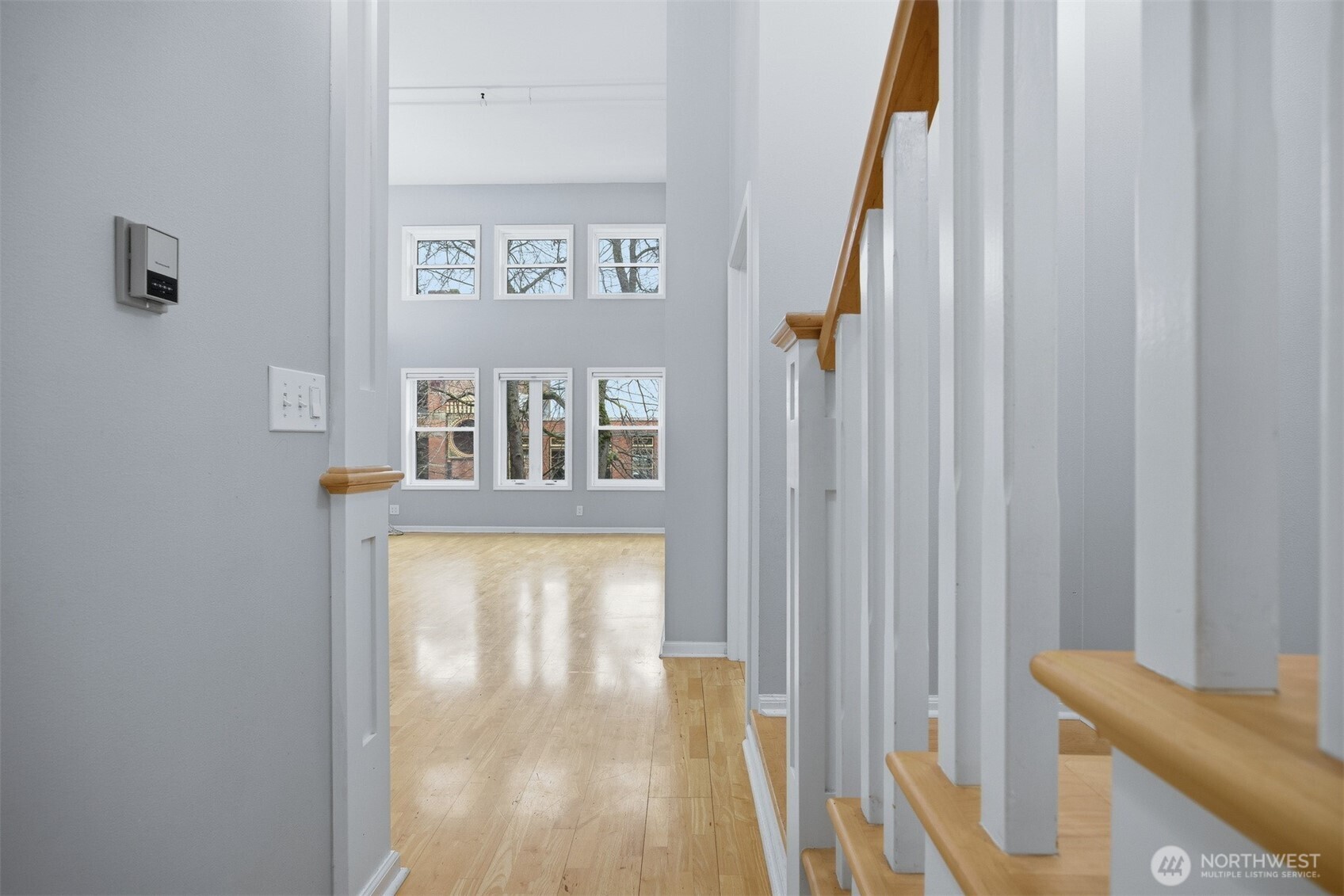 1201 11th Street, Unit 303 Bellingham, WA 98225 - Photo 4 of 34 a view of a hallway with wooden floor and a bathroom