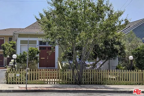 a view of a house with a garden