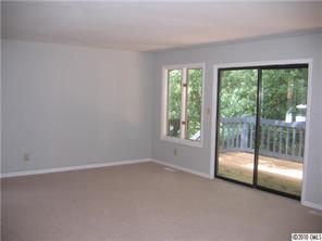 3112 Point Clear Drive Tega Cay, SC 29708 - Photo 6 of 16 an empty room with sliding glass door and windows