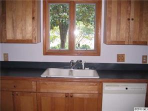 3112 Point Clear Drive Tega Cay, SC 29708 - Photo 8 of 16 a kitchen with a sink and a window